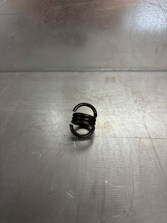 RETURN SPRING